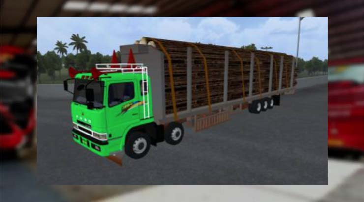 Truk Fuso Hijau Muatan Kayu